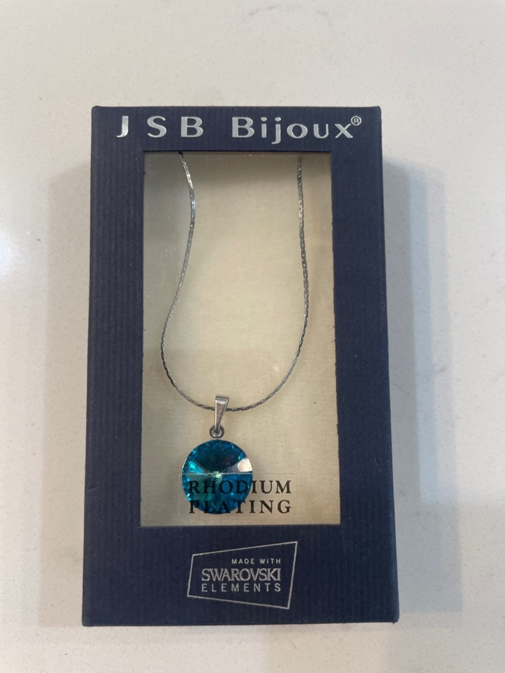 Rhodium-Plated Necklace with Teal Crystal Pendant